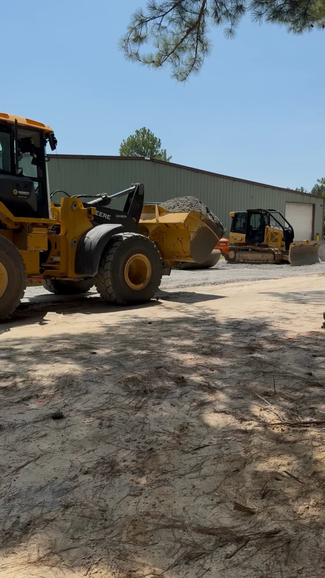 Ward Excavation John Deere wheel loader moving gravel at the company's Whiteville, NC equipment yard.